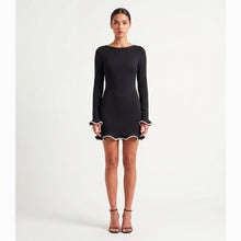 Mini abito nero con balze in jersey