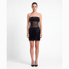 Mini abito nero in paillettes con trasparenze