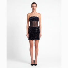 Mini abito nero in paillettes con trasparenze