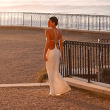 Long white satin dress with jewel detail
